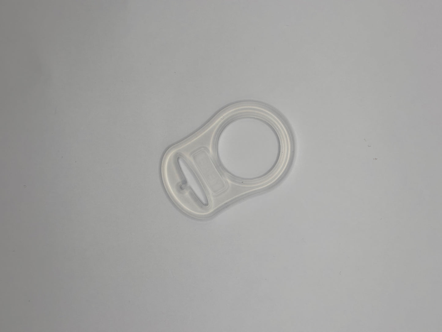 Adaptateur en silicone pour attache tétine