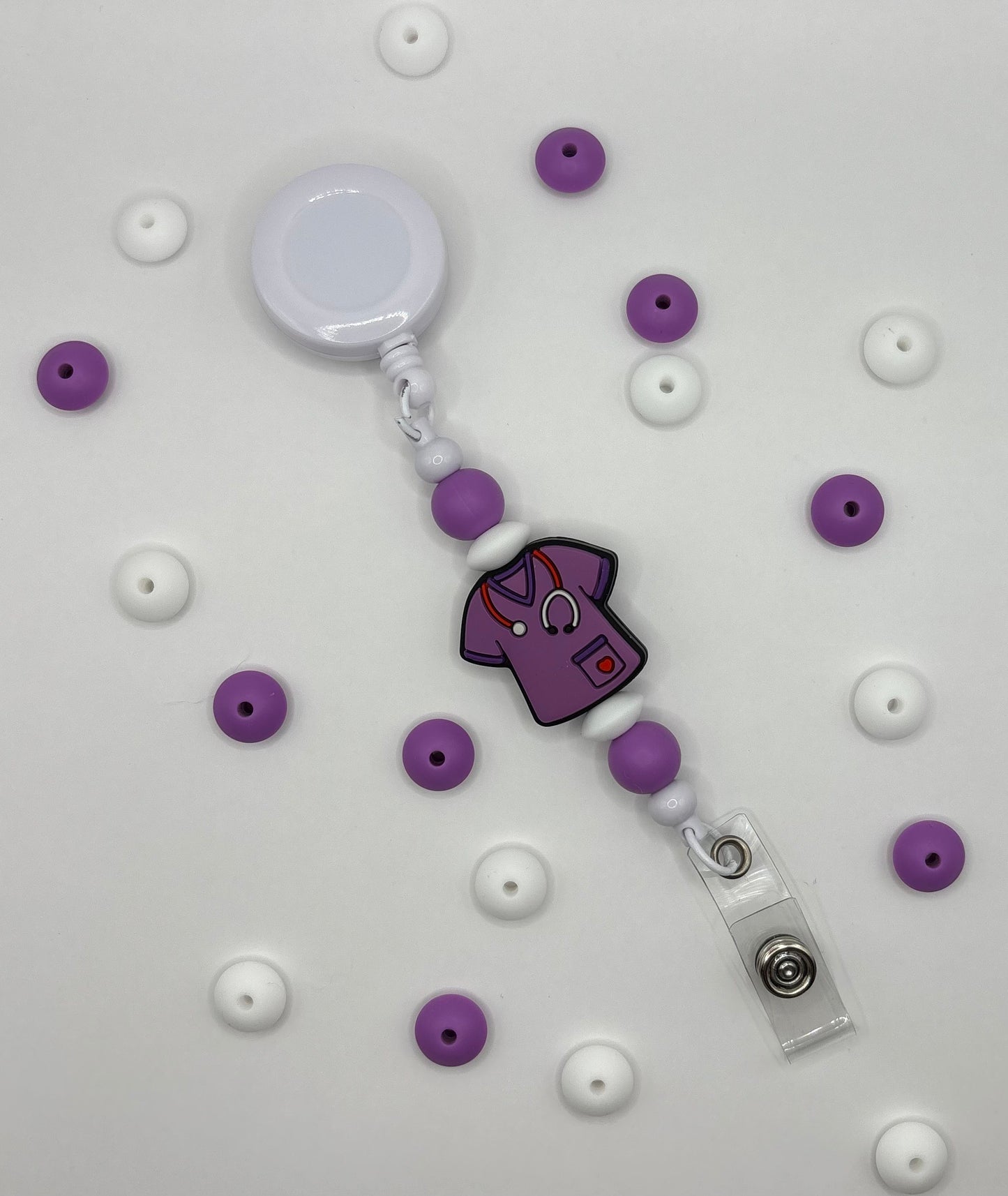 Attache rétractable pour badge